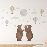 The Bears & Moon Stickers by My Store are whimsical, removable wall decals featuring two large bears and a cub with a balloon under the moon. This dreamy scene, complete with pastel clouds, birds, stars, and hot air balloons, is perfect for nursery walls.