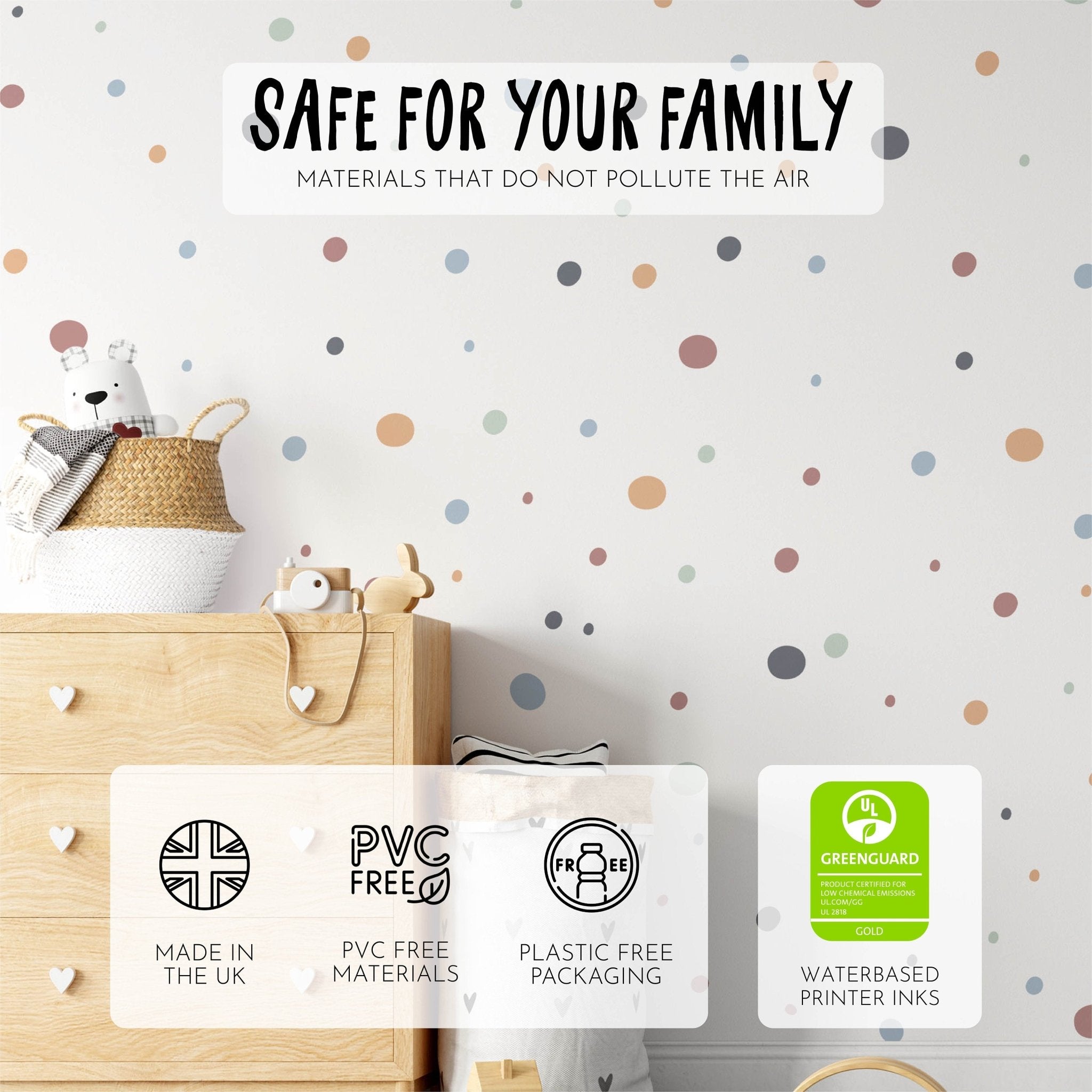 A cozy childrens room features Boho Polka Dots Stickers by My Store on the wall behind a wooden dresser with heart-shaped knobs. A woven basket with a teddy bear sits atop. Made in the UK, these decals are PVC-free and come in plastic-free packaging, ensuring child safety.