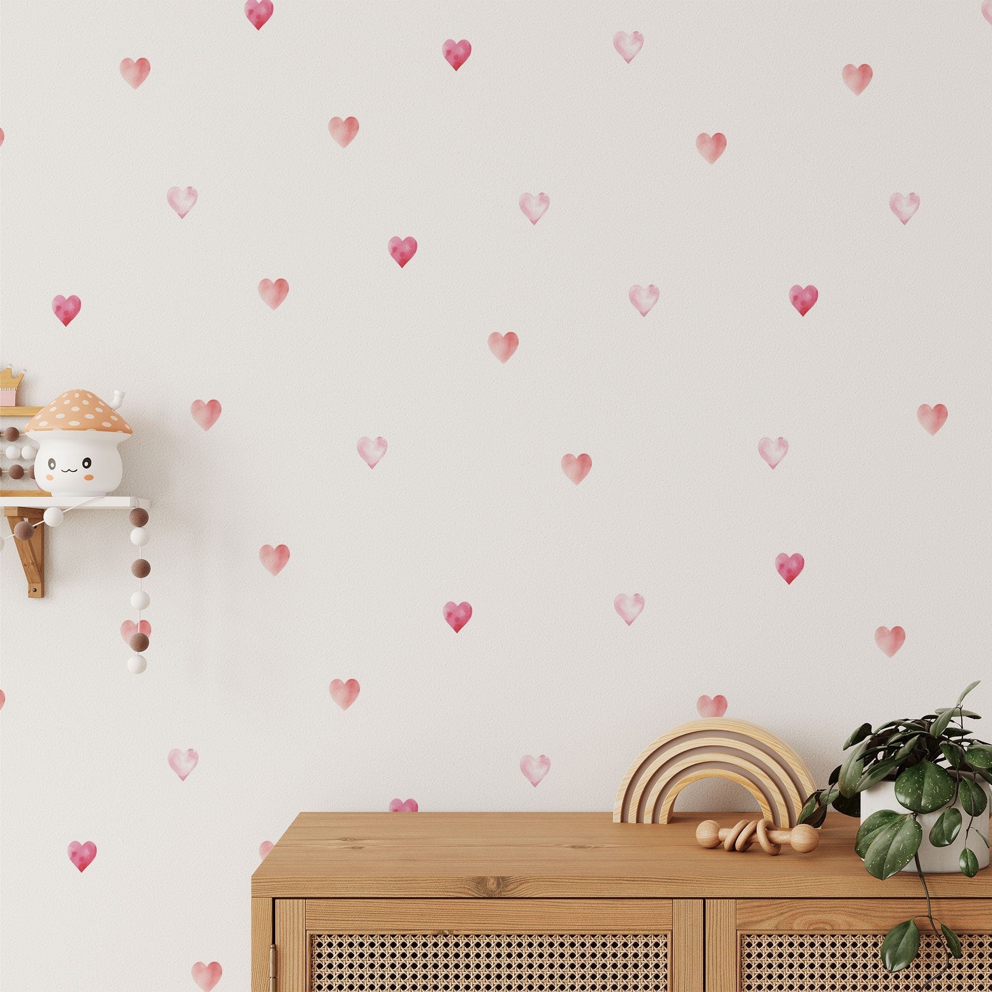 A room featuring Watercolour Heart Stickers from My Store, a small wall shelf with mushroom decor, and a wooden cabinet adorned with a plant and rainbow decor.